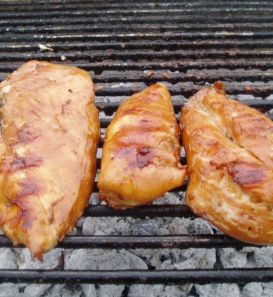 Bourbon Chicken cooking on charcoal grill